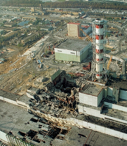Aerial photograph of Reactor No. 4 at Chernobyl after the explosion, its roof collapsed and debris scattered around it
